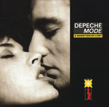 a black and white photo of a man and woman kissing on the album cover of depeche mode a question of lust .