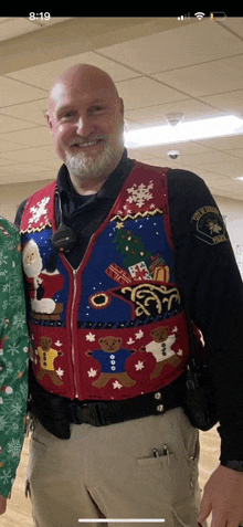 a police officer wearing a ugly christmas vest