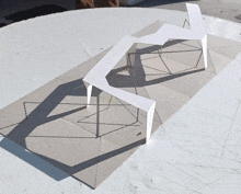 a model of a building is sitting on top of a white surface