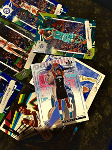 a stack of basketball cards including luka doncic