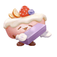 a cake with a strawberry and blueberry on top