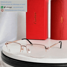 a pair of cartier glasses sitting on a white table