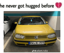 a yellow car with a license plate that says rwk777