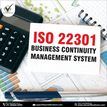 iso 22301 business continuity management system is written on a piece of paper next to a calculator