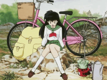 a girl in a school uniform sits on a rock next to a pink bicycle .