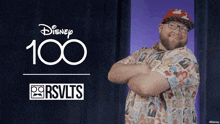 a man with his arms crossed in front of a disney 100 rsvlts logo