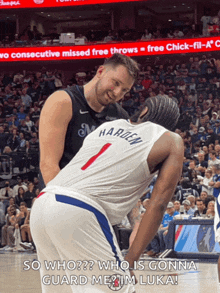 a basketball player with the number 1 on his jersey talks to another player