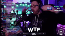 a man with glasses and headphones says wtf