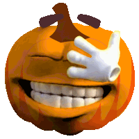 a smiling pumpkin with a hand covering half of its face