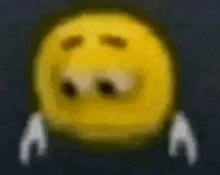 a blurry picture of a yellow smiley face with white hands behind its eyes .