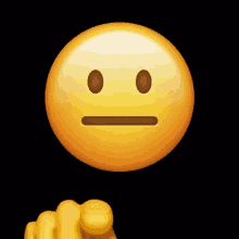 a yellow finger pointing at a smiley face with a black background