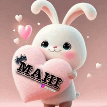 a stuffed bunny holding a heart that says mahi