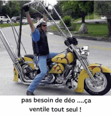 a man is riding a motorcycle with the words pas besoin de deo