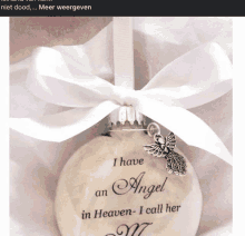 a christmas ornament that says " i have an angel in heaven - i call her "