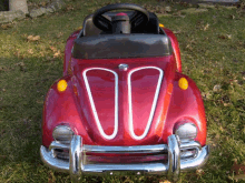 a red toy car with the number 00 painted on it