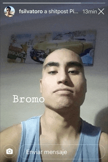 a man with a shaved head has the name bromo on his face