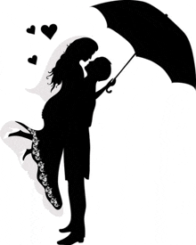 a silhouette of a man holding a woman in his arms under an umbrella .