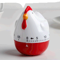 a red and white chicken shaped timer that shows the time as 55 seconds