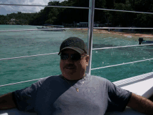 a man on a boat wearing a hat that says ' texas rangers ' on it