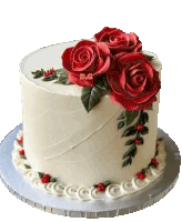 a white cake with red roses and the letters a.c.