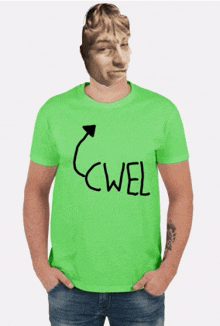 a man wearing a green t-shirt with the word cwel written on it