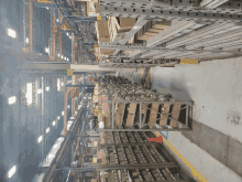 a warehouse filled with lots of boxes and a yellow sign that says ' a ' on it