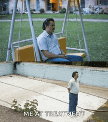 a man sitting on a swing next to a pool with the words " me at treatment " below him