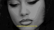 a black and white photo of a woman 's face with a caption that says `` i begged him not to trust me '' .