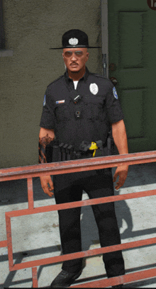 a police officer wearing a hat and sunglasses stands behind a fence