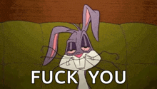 bugs bunny from looney tunes is laying on a couch with his eyes closed and says fuck you