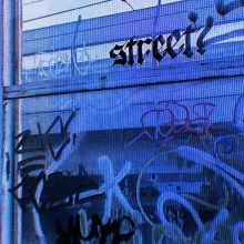 the word street is written in black letters on a blue background