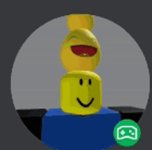 a yellow smiley face is stacked on top of a blue block