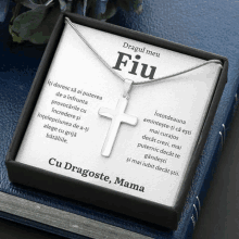 a necklace in a box that says dragul meu fiu