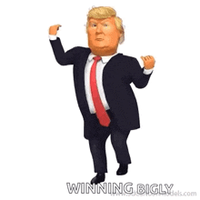 donald trump is wearing a suit and tie and is dancing .