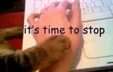 a picture of a person using a computer mouse with the words it 's time to stop written on it