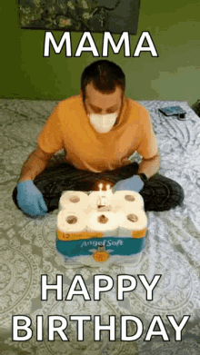 a man wearing a mask and gloves sitting on a bed with a birthday cake made out of toilet paper