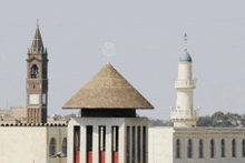 a clock tower and a mosque are visible in a city