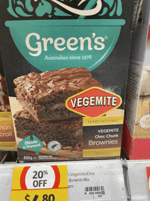 a box of green 's vegemite choc chunk brownies sits on a shelf