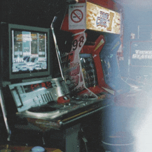 an arcade game with a sign that says no smoking on it