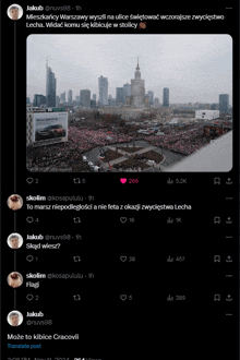 a screenshot of a twitter post with a picture of a crowd in a city