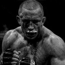 a black and white photo of a fighter with the words ok my turn below him