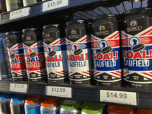 several cans of goal gaufield pale ale are lined up on a shelf