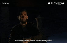 a man with a beard says " because you 're a little spider-man junior " on a phone screen