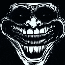 a black and white drawing of a monster 's face with a big smile and a lot of teeth .