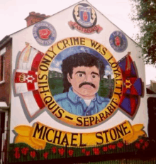 a mural of a man with a mustache and the words " crime was loyalty "