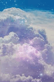 a cloudy sky with purple and white clouds and stars in it .