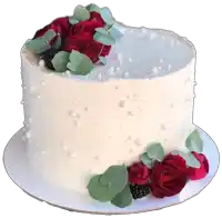 a white cake with roses and pearls on top