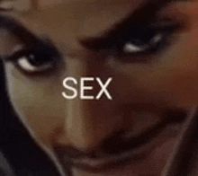 a close up of a woman 's face with the word sex written above it .