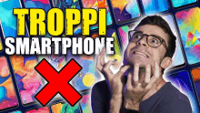 a man wearing glasses stands in front of a bunch of cell phones with the words troppi smartphone written above him