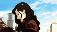 a woman with long black hair and red armor is looking down